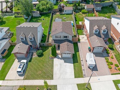 Two-story residence with a front-facing garage and an expansive concrete driveway - 311 Misty Crescent, Kitchener, ON - Outdoor With View