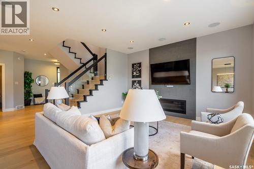 4311 Sandpiper Crescent E, Regina, SK - Indoor Photo Showing Living Room With Fireplace
