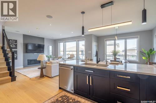 4311 Sandpiper Crescent E, Regina, SK - Indoor Photo Showing Kitchen With Fireplace With Upgraded Kitchen