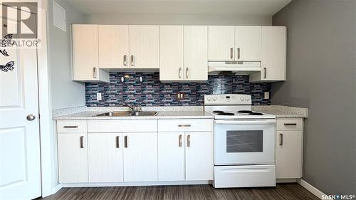 215 V Avenue N, Saskatoon, SK - Indoor Photo Showing Kitchen With Double Sink