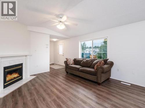 413-989 Range Road, Whitehorse, YT - Indoor Photo Showing Living Room With Fireplace