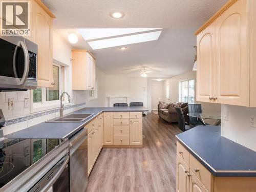 413-989 Range Road, Whitehorse, YT - Indoor Photo Showing Kitchen With Double Sink