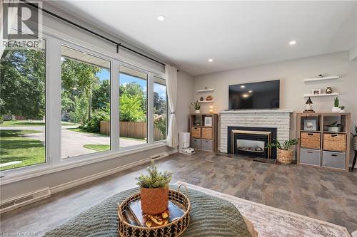 16 Gibson Drive, Simcoe, ON - Indoor Photo Showing Living Room With Fireplace