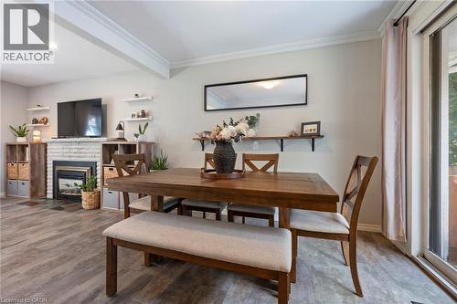 16 Gibson Drive, Simcoe, ON - Indoor Photo Showing Dining Room With Fireplace