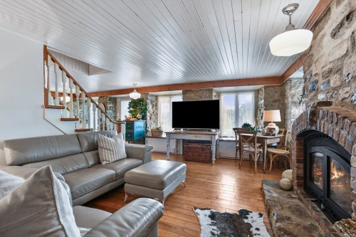Overall view - 647 Boul. Lacombe, Repentigny (Le Gardeur), QC - Indoor Photo Showing Living Room With Fireplace