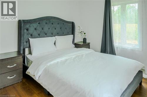 Hardwood-style flooring throughout - 107 6Th Line Line, Haldimand, ON - Indoor Photo Showing Bedroom