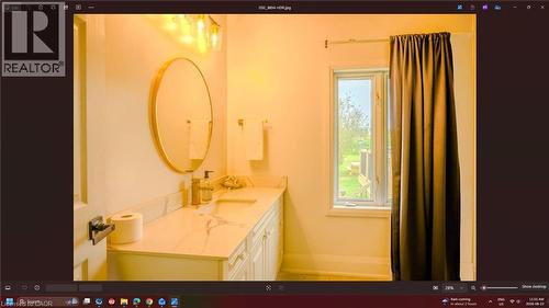 White vanity with integrated sink, stone-finish countertop, and wall-mounted lighting - 107 6Th Line Line, Haldimand, ON - Indoor Photo Showing Bathroom
