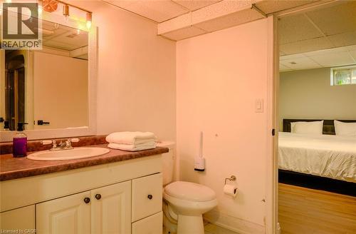 Vanity with integrated sink, wall-mounted mirror, and track lighting fixture - 107 6Th Line Line, Haldimand, ON - Indoor Photo Showing Bathroom