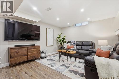 Recessed lighting, wood-finish flooring, and a window well provide illumination - 563 Westvale Drive, Waterloo, ON - Indoor
