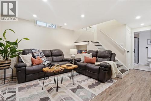 Recessed lighting, wood-finish flooring, built-in shelving, white trim, and a white door leading to a bathroom with a shower - 563 Westvale Drive, Waterloo, ON - Indoor