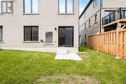 Rear yard and unit entrance - 