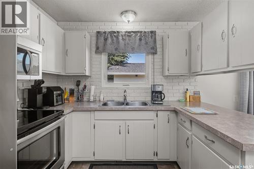 21 Plaxton Place, Prince Albert, SK - Indoor Photo Showing Kitchen With Double Sink
