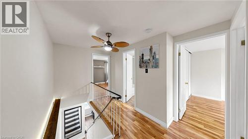 Hardwood flooring throughout, contemporary ceiling fan, and white painted walls - 304 Bluevale Street N, Waterloo, ON - Indoor Photo Showing Other Room
