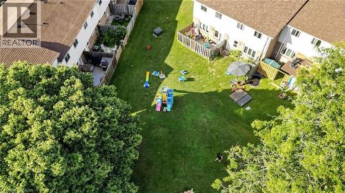 Expansive green space featuring large mature trees and a manicured lawn - 304 Bluevale Street N, Waterloo, ON - Outdoor