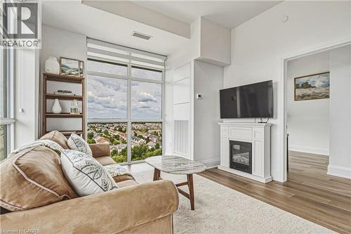 470 E Dundas Street E Unit# 1202, Waterdown, ON - Indoor Photo Showing Living Room With Fireplace