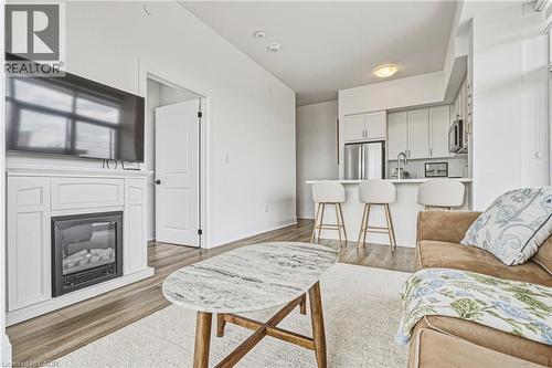470 E Dundas Street E Unit# 1202, Waterdown, ON - Indoor Photo Showing Living Room With Fireplace