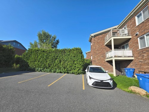 Parking - 2-5690 Rue Chevalier, Brossard, QC - Outdoor With Balcony