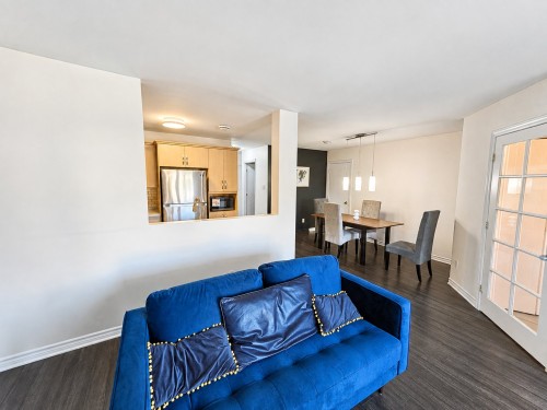 Living Room - 2-5690 Rue Chevalier, Brossard, QC - Indoor Photo Showing Other Room