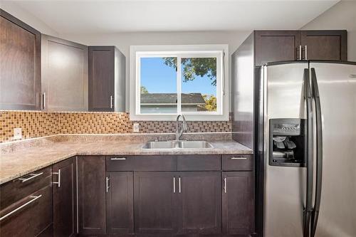 723 Mclean Ave, Selkirk, MB - Indoor Photo Showing Kitchen With Double Sink