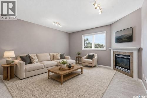 7 110 Dulmage Crescent, Saskatoon, SK - Indoor Photo Showing Living Room With Fireplace