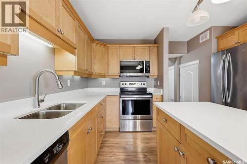 7 110 Dulmage Crescent, Saskatoon, SK - Indoor Photo Showing Kitchen With Stainless Steel Kitchen With Double Sink