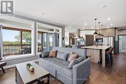 LR adjoins kitchen, open-concept style. - 