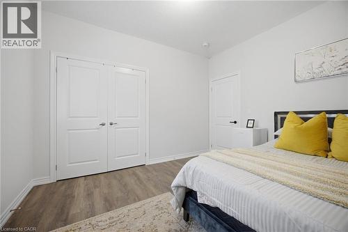 Wood-finish flooring throughout, bright white walls, and a recessed ceiling light - 20 Todd Crescent, Dundalk, ON - Indoor Photo Showing Bedroom
