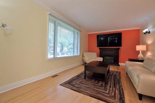 321 Guildford St, Winnipeg, MB - Indoor Photo Showing Living Room With Fireplace