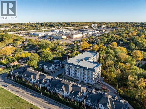Modern multi-story residential building with a grey facade - 2 Arbourvale Common Unit# 209, St. Catharines, ON - Outdoor With View