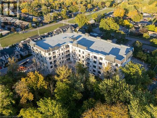 Multi-story building featuring balconies, a conical roof element, and a flat roofline - 2 Arbourvale Common Unit# 209, St. Catharines, ON - Outdoor With View