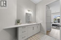 Extended vanity with a white countertop, undermount sink, and brushed nickel faucet - 