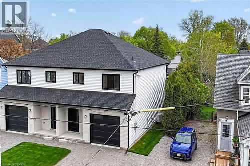 Modern multi-unit residence with white siding and a dark shingle roof - 45B Howard Street, Hagersville, ON 