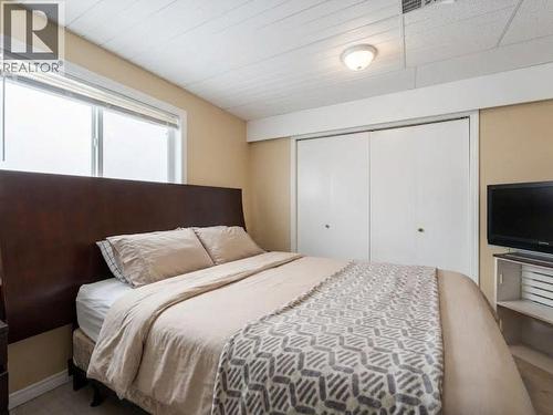 Suite Bedroom 1, virtually staged. - 3368 Mciver Road, West Kelowna, BC 