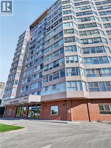 High-rise residential building with a multi-faceted facade and extensive window placements - 7 Gale Crescent Unit# 1107, St. Catharines, ON 