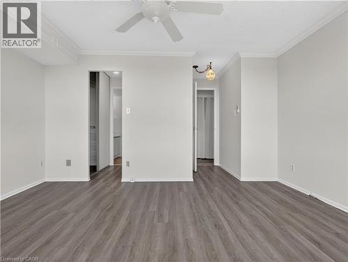 Wood-finish flooring, crown molding, ceiling fan, and recessed light fixture - 7 Gale Crescent Unit# 1107, St. Catharines, ON 