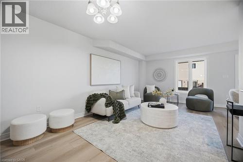Recessed lighting and a decorative chandelier illuminate the space - 98 Bloom Crescent, Stoney Creek, ON 