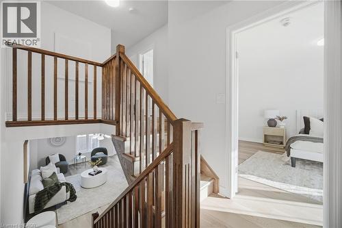 Open concept living area with wood-finish flooring - 98 Bloom Crescent, Stoney Creek, ON 