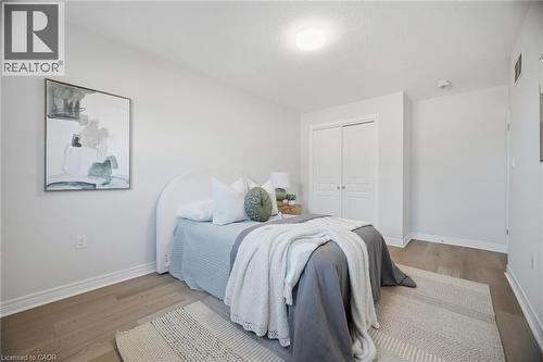 Recessed lighting, wood-finish flooring, and white walls - 98 Bloom Crescent, Stoney Creek, ON 
