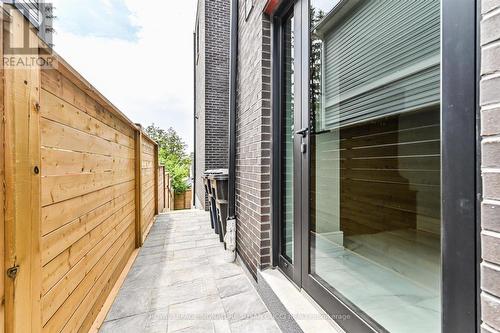 Wide pathway to backyard - 96 Squires Avenue, Toronto, ON 