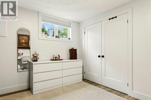 Wood-finish flooring with white walls - 9 Midway Street, Hamilton, ON 