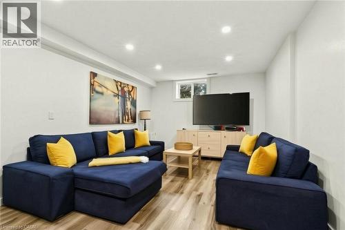 Recessed lighting, wood-finish flooring, light-toned walls, and a built-in window - 9 Midway Street, Hamilton, ON 