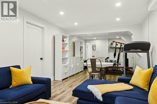 Recessed lighting, wood-finish flooring, and built-in white cabinetry - 9 Midway Street, Hamilton, ON 