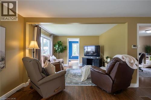 Hardwood-style flooring throughout, with a wide cased opening into an additional room - 78 Oak Street, Simcoe, ON 