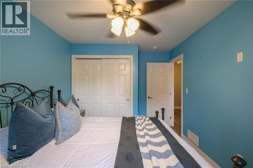 Ceiling fan light fixture, sliding closet doors, and interior door with lever hardware - 78 Oak Street, Simcoe, ON 