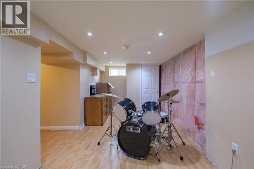 Wood-finish flooring with recessed lighting, an interior door, and a horizontal window - 78 Oak Street, Simcoe, ON 