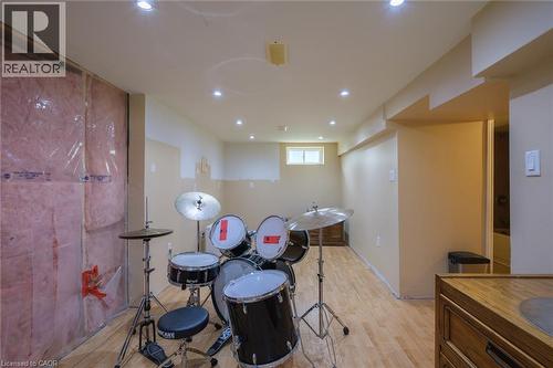 Recessed lighting throughout, wood-finish flooring, and exposed insulation - 78 Oak Street, Simcoe, ON 