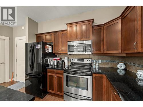 Beautiful kitchen with black granite counters. - 3545 Carrington Road Unit# 108, West Kelowna, BC 