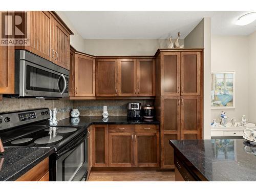 Tons of cupboards and a pantry. - 3545 Carrington Road Unit# 108, West Kelowna, BC 