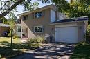 Brick exterior with white siding accents and a single-car garage - 52 Brier Park Road, Brantford, ON 