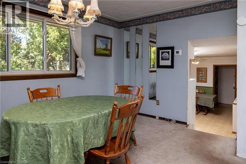 Recessed lighting, wood-trim window, wall-mounted mirror panels, and a decorative ceiling light fixture - 52 Brier Park Road, Brantford, ON 